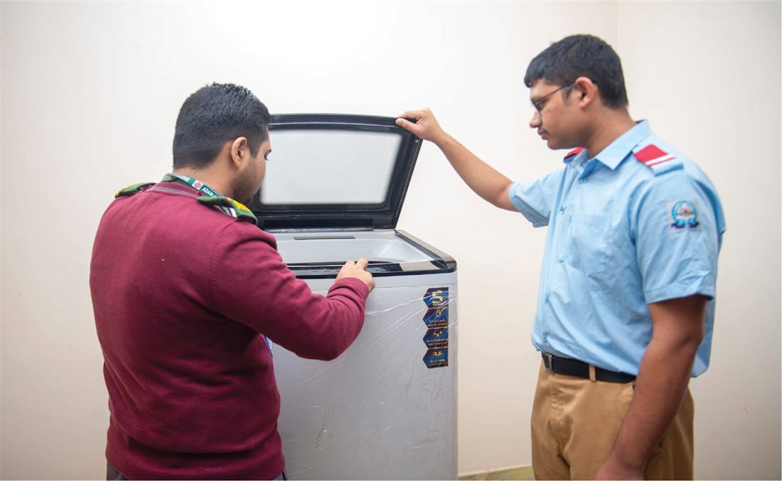 Automatic washing machine laundry facility at Green Heaven Super Hostel